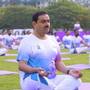 In pix: Adani, Sitharaman strike a yoga pose