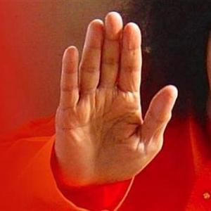 Sathya Sai Baba's devotees pray for a miracle 