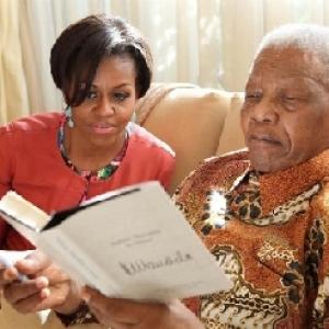 IMAGES: Michelle Obama's candid moments with the Mandelas