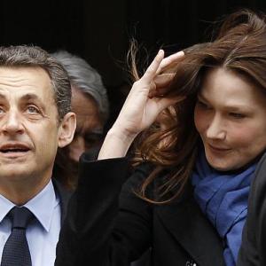 Sarkozy's fingers crossed as polls begin in France