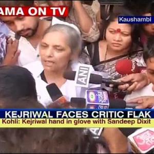 Drama at Kejriwal's press meet, woman confronts him