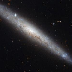 NASA captures pictures of dusty spiral galaxy
