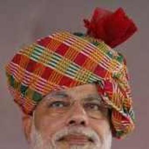 JD-U's jibe: Modi can serve India by being CM