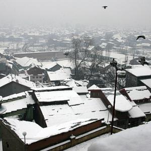 IN PICS: Heavy snowfall shuts down Kashmir
