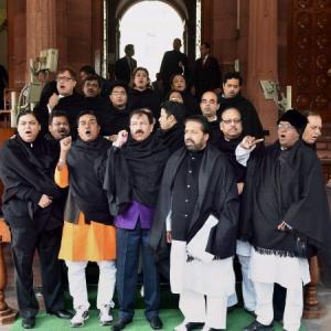 After black umbrellas, TMC brings black shawls to Parliament