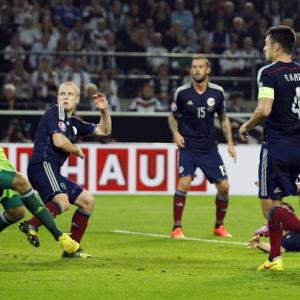 Euro qualifier: Mueller double helps Germany edge past Scotland