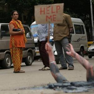 Help! Is this woman drowning in Bengaluru's pothole?