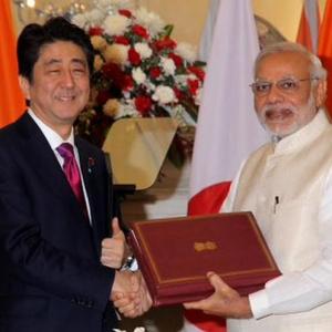Modi, Japan's Shinzo Abe put bullet train on track, sign defence agreements