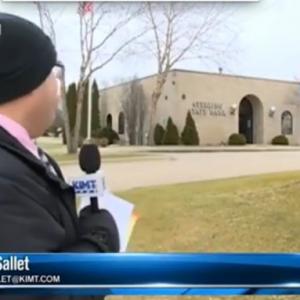 Reporter sees bank robbery on live TV
