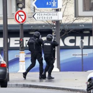 Female suspect in French hostage situation 'on the run'