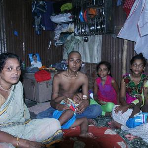 In a dark, dingy, slum, families cope with Mumbai's hooch tragedy