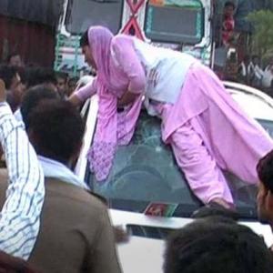 Woman smashes SP leader's car after his guard winked at her