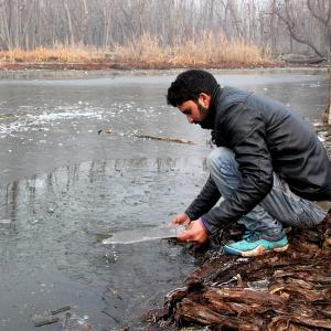 PIX: Freezing cold leaves Kashmir shivering