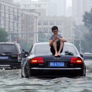 'Floods submerged my bed': 250 killed or missing in China rains