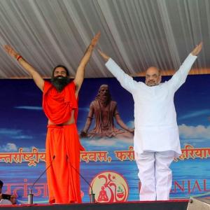 PIX: Smriti, Rajnath, Naqvi roll out the yoga mat