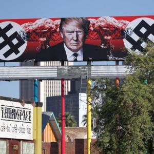 Now, a US billboard shows Trump with swastika-like symbols