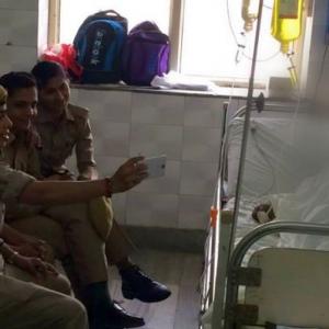 UP: 3 women cops suspended after taking selfies with acid attack victim