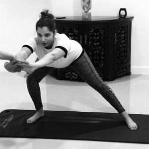 Sania practises prenatal yoga, gets praise from Maneka Gandhi