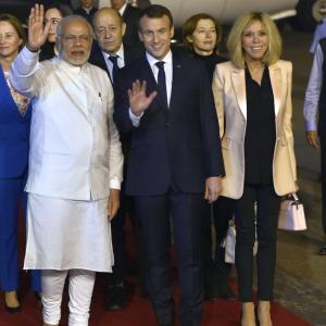 With handshake and hug, PM Modi welcomes Macron at airport
