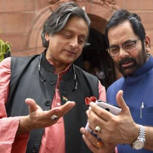 Caption this: What's Tharoor telling Naqvi?