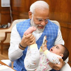 Modi has 'aww' moment with baby in Parliament