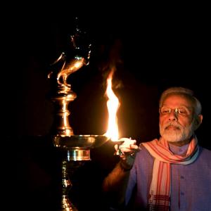 Indians light lamps to unite in fight against COVID-19
