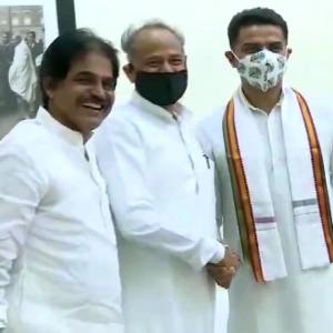 With smile, handshake, Pilot meets Gehlot after truce