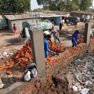 Ahmedabad builds Trump wall to keep slums out of sight