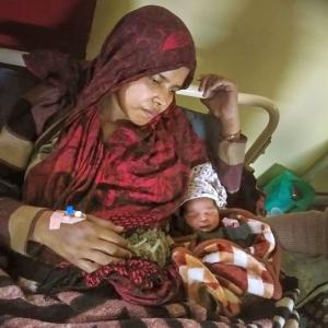 Kicked in stomach by mob, woman gives birth to baby