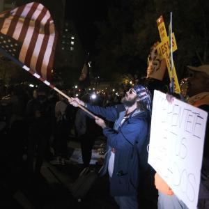 As US counts votes, protesters take to the streets