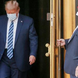 Trump returns to White House, removes mask for photos