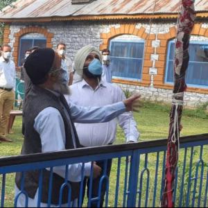 Terrorist Burhan Wani's father hoists tricolour in JK