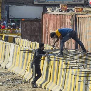 Nail-studded roads, barriers: Protest sites fortified