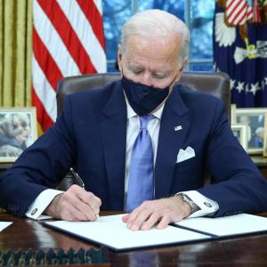 Biden signs executive actions on COVID, climate change