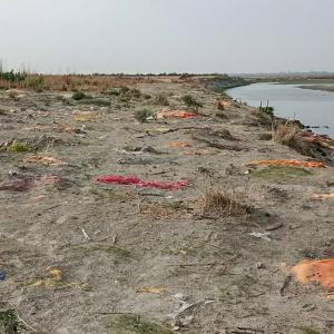 Now, bodies found buried in sand near Ganga