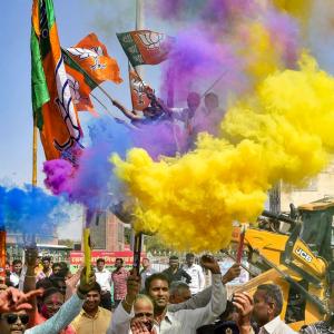 PHOTOS: BJP, AAP celebrate Holi early with poll win