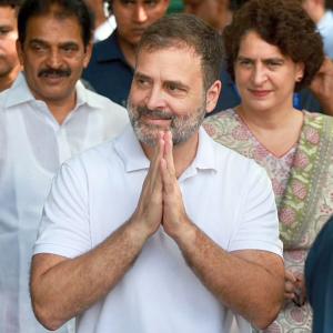 Rahul's disqualification as MP revoked, attends House