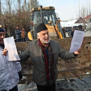 J-K officials raze outer walls of ex-minister's house