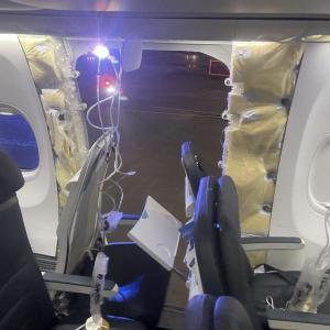 Plane door blows out mid-air, forces emergency landing