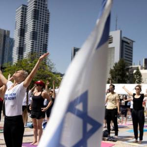 Amid war, hundreds join Yoga Day events in Israel