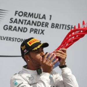 Hamilton wins at home after Rosberg retires