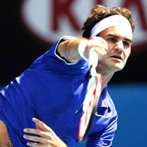 Federer eases into home-town quarter-finals