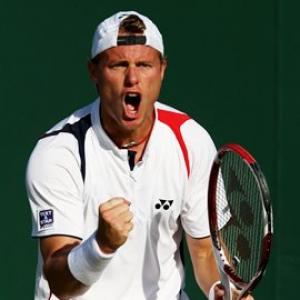 Hewitt soldiers on, Tomic claims biggest win