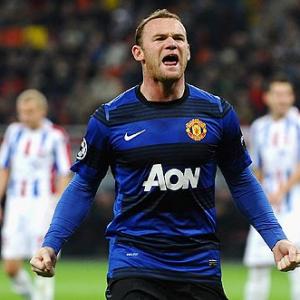 CLeague: Rooney fires United, late Aguero goal seals City win