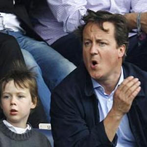 First Look: British PM Cameron at English Premier League match