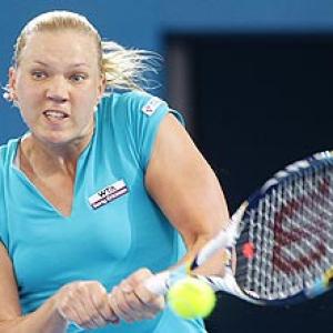 Clijsters eases into semis, Kanepi upsets Petkovic