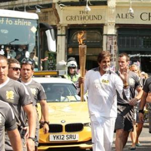 First Look: Big B carries Olympic flame in London