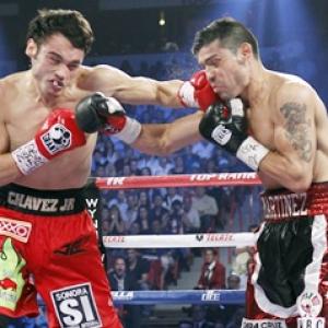 Martinez survives knockdown, beats Chavez