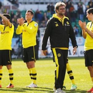 Dortmund hit six and Bayern four in easy wins