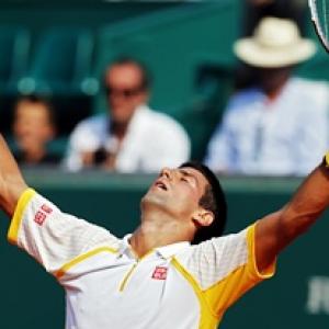 Djokovic battles through pain, Nadal finds it easy